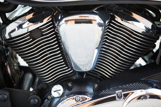 Shiny chromium-plated motorcycle engine closeup photo