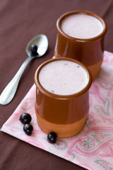 Homemade yogurt with berries in a ceramic bowl