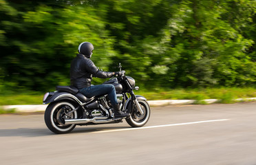 Naklejka premium slow motion, biker riding unknown motorbike with blur movement,