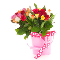Colorful bouquet mixed roses in bucket