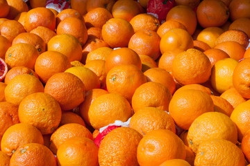 Blood oranges on market stand as background
