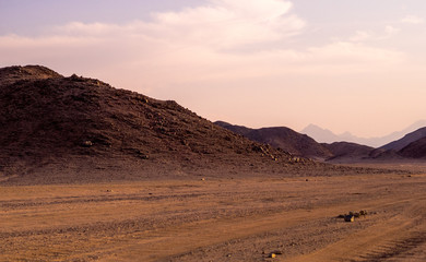 Fototapeta na wymiar Sunset at the hills on the stone desert