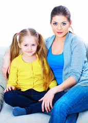 Home portrait of woman with girl.