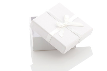 ajar white gift box on a white background