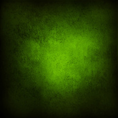 Green textured concrete wall background. Dark edges