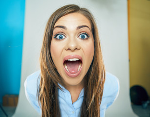 funny face of young business woman . open mouth. teeth.