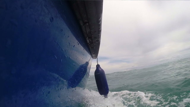 catamaran in the sea with float on the broadside
