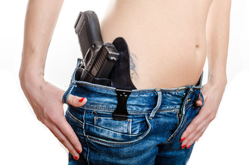 Concealed carry gun in his waistband - obrazy, fototapety, plakaty