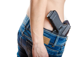 Concealed carry gun in his waistband - obrazy, fototapety, plakaty