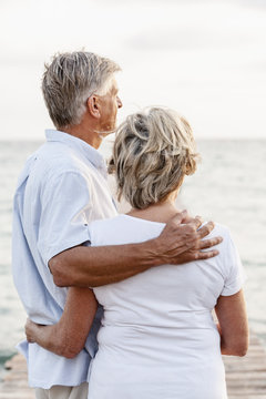 Spain, Senior couple standing at the sea