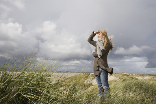 Germany, Schleswig Holstein, Amrum, Woman Looking out to Sea