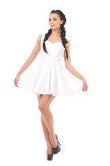 beautiful young brunette in a white dress