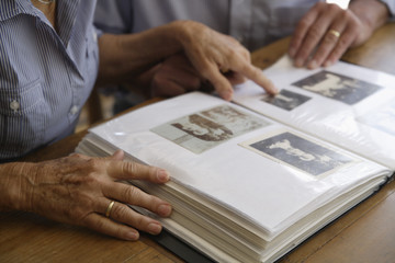 Germany, Bavaria, Senior couple with photo album