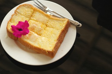 Bread, butter, topped  milk with tasty.