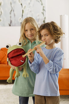 Girl and boy -, playing recorder