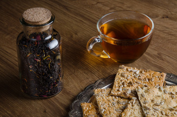 Glass cup tea with cookies