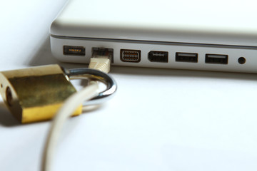 Fototapeta premium Lock on white laptop at the desk