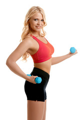 Sexy girl doing fitness exercise with dumbbells
