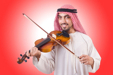 Arab man playing music on white