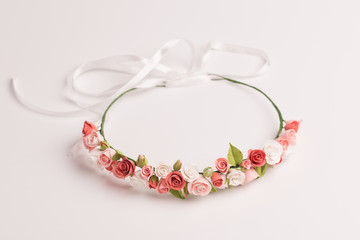 tiara with handmade flowers on a white background