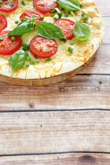 Tasty pizza with tomato
