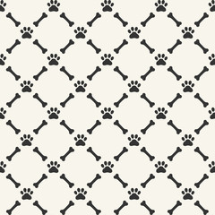 Seamless background with dog paw print and bone © Happy Art