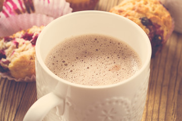 Cup cocoa with milk and homemade black berry muffins