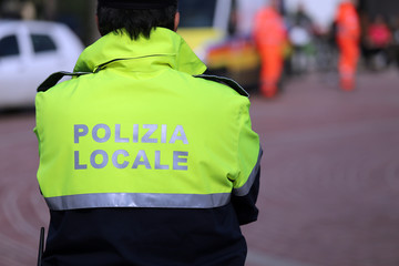 Italian policeman of local police check the city