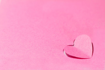 Fototapeta premium Pink paper hearts and pink background