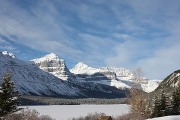 Canadian mountain in front of a frozen lake