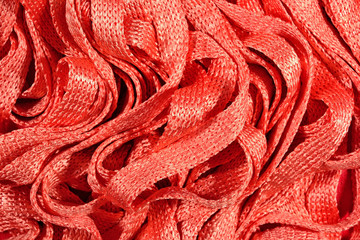 Fototapeta na wymiar Orange stockinet ribbons background