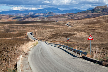 Road running through a sicilian valley