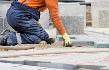 Paver working on knees