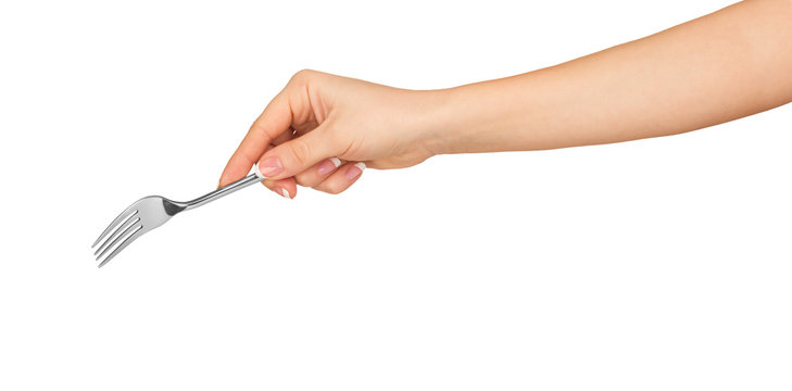 Hand Holding A Silver Fork On An Isolated White Background