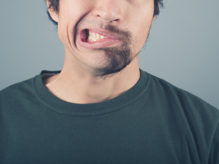 Man with half shaved beard