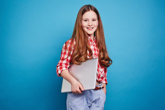 Smiling girl with laptop