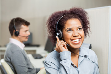Cheerful Female Customer Service Representative In Office