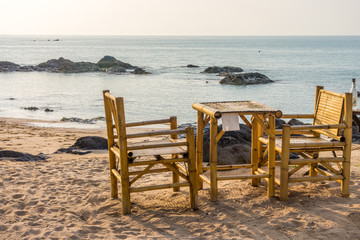 Bamboo chairs and table with clear sky on Pak Weep beach