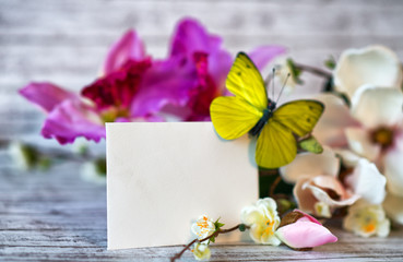 Blank Card with Butterfly and Flowers on Table