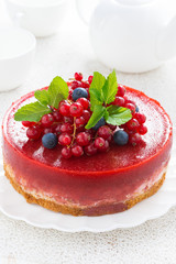 Delicious cheesecake with berry jelly on a plate