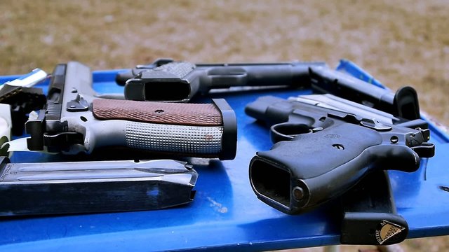 Guns on the blue table, shooting range