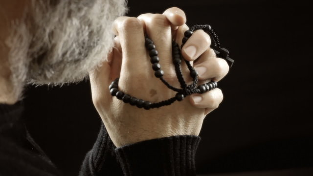 Religion pray rosary beads believer