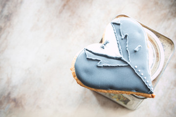 Heart in a suit on the table..