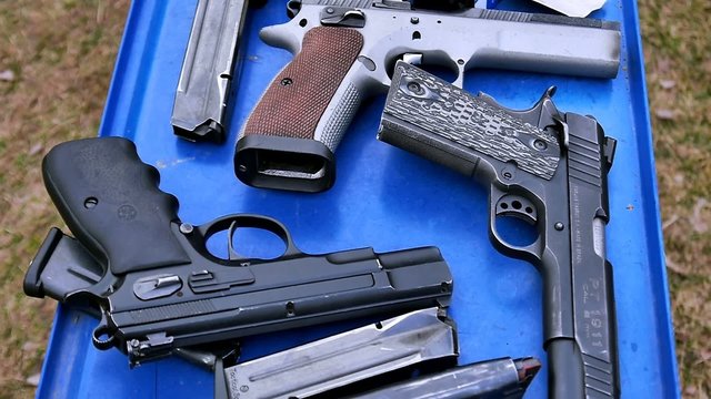 Guns on the blue table, shooting range