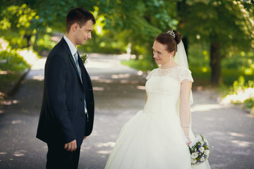 bride and groom in the park