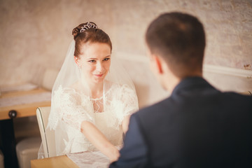bride and groom sitting table