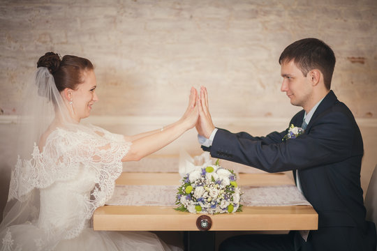 Bride And Groom Sitting Table