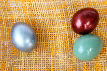 Colorful easter egg on bamboo weave background.