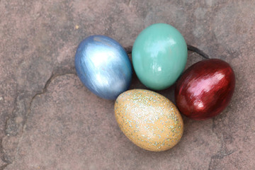 Colorful easter eggs on stone floor.