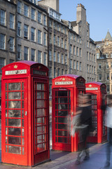 Old red telephone booths Royal mile street in Edinburgh